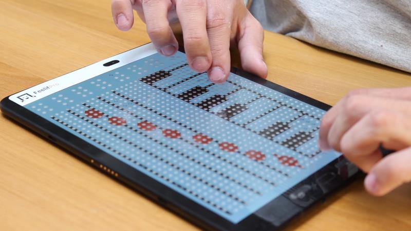 Playing simple melodies on a tactile book